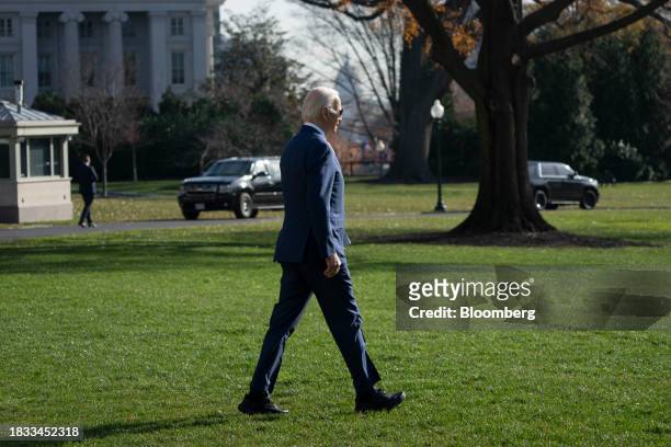 President Joe Biden walks on the South Lawn of the White House before boarding Marine One in Washington, DC, US, on Friday, Dec. 8, 2023. House...