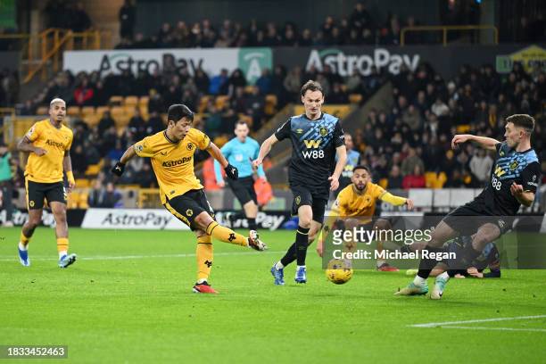 Hwang Hee-Chan of Wolverhampton Wanderers scores the team's first goal during the Premier League match between Wolverhampton Wanderers and Burnley FC...