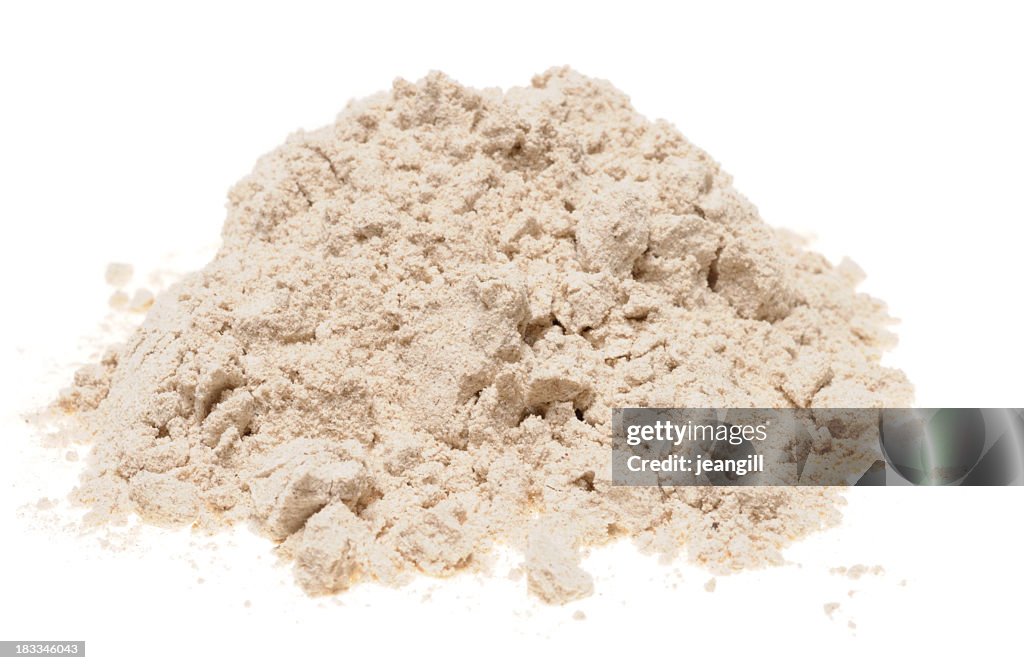 Pile of buckwheat flour on a white background