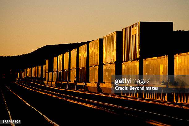 container train at sunset - rail freight stock pictures, royalty-free photos & images