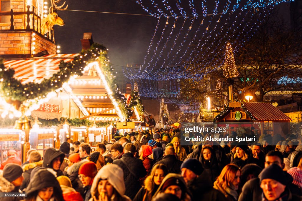 Crowds of people visiting Christmas Market on Breitscheidplatz in Berlin, Germany