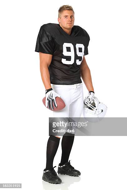 football player with a ball and helmet - american football player white background stock pictures, royalty-free photos & images