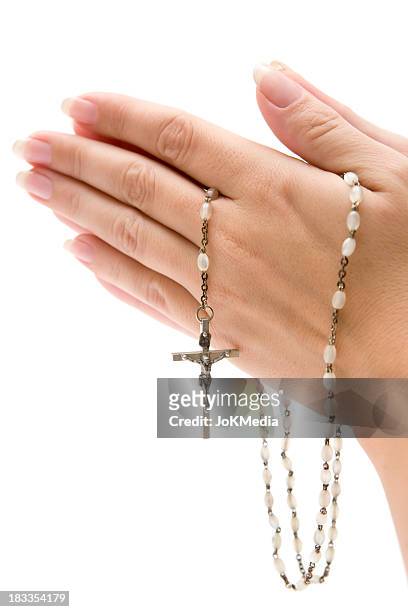 praying the rosary - rosary beads stock pictures, royalty-free photos & images