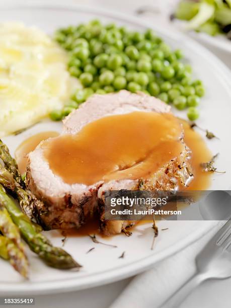 pork roast dinner with gravy - roast pig stock pictures, royalty-free photos & images