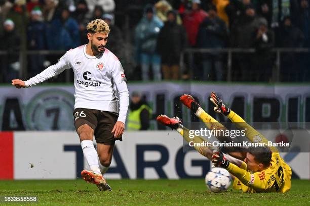 Elias Saad of FC St. Pauli scores the team's second goal as Tom Kretzschmar of FC 08 Homburg fails to make a save during the DFB cup round of 16...