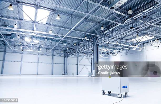 large white and gray storehouse and one machine - cosmos plant stock pictures, royalty-free photos & images