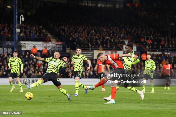 Ross Barkley of Luton Town scores the team's third goal whilst under pressure from Ben White of Arsenal during the Premier League match between Luton...