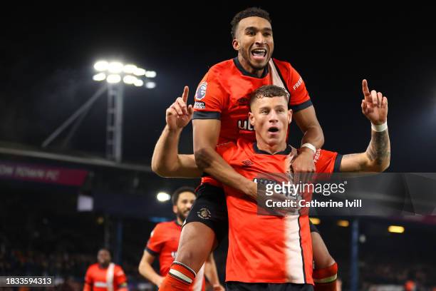 Ross Barkley of Luton Town celebrates after scoring the team's third goal with teammate Jacob Brown during the Premier League match between Luton...