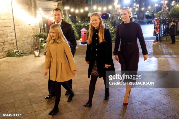 Savannah Phillips, Peter Phillips, Isla Phillips and Zara Tindall arrive for the "Together At Christmas" Carol Service" at Westminster Abbey in...