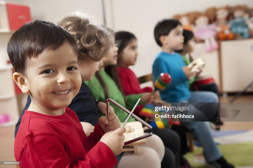 Preschool age children in music class