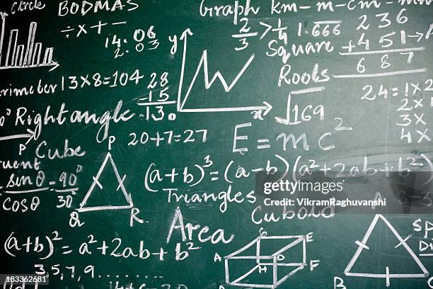 mathematics problems on a greenboard - einstein stock pictures, royalty-free photos & images