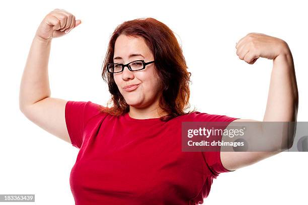 confident woman shows off arms - smug women stock pictures, royalty-free photos & images