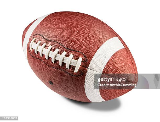 brown and white american football on white background - football stock pictures, royalty-free photos & images
