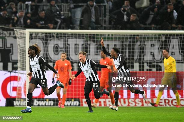 Manu Kone of Borussia Moenchengladbach celebrates after scoring the team's first goal during the DFB cup round of 16 match between Borussia...