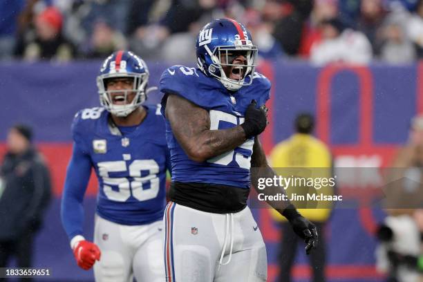 Jihad Ward and Bobby Okereke of the New York Giants in action against the New England Patriots at MetLife Stadium on November 26, 2023 in East...