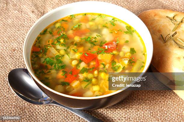 vegetable soup in white porcelain bowl - vegetable soup stock pictures, royalty-free photos & images
