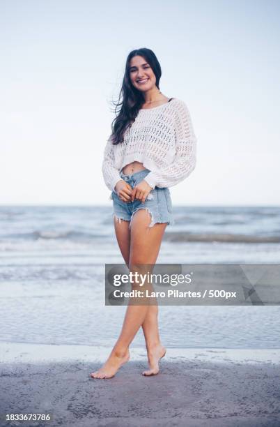 portrait of young woman standing at beach,corpus christi,texas,united states,usa - corpus christi stock pictures, royalty-free photos & images