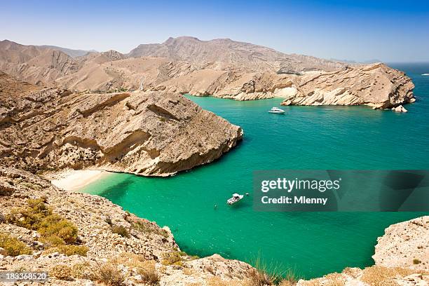 beautiful oman coast green lagoon with hidden beach - persian gulf countries stock pictures, royalty-free photos & images