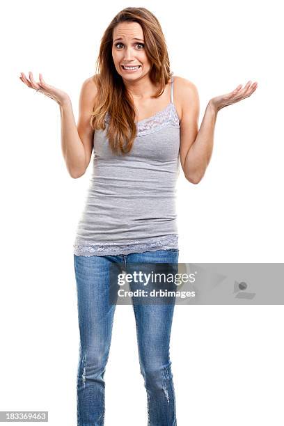 nervous shrugging young woman - shrugging stock pictures, royalty-free photos & images