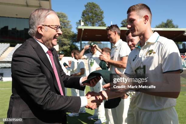 Prime Minister of Australia Anthony Albanese presents a Prime Ministers XI cap to Cameron Bancroft during day one of the Tour Match between the Prime...