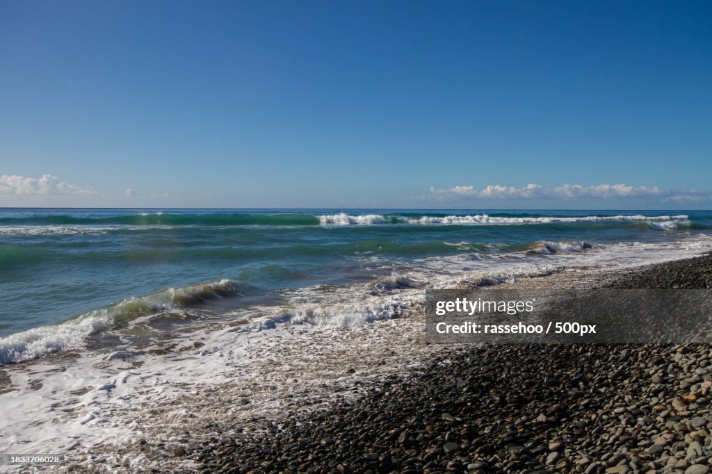 Scenic view of sea against clear blue sky
