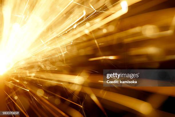 abstract sparkler background - gold sparks stock pictures, royalty-free photos & images