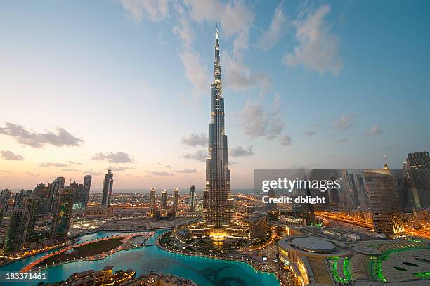 city lights in dubai at sunset - dubai aerial stock pictures, royalty-free photos & images