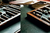 An abacus laying on a green table