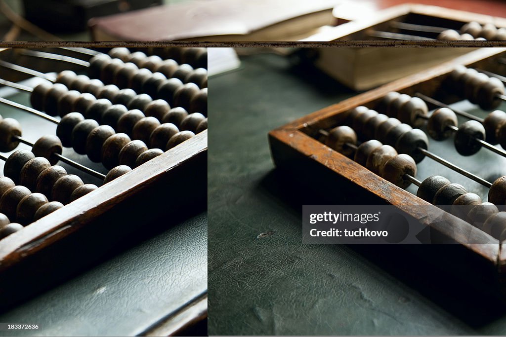 An abacus laying on a green table