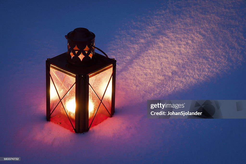 Red Candle Lantern In Snow