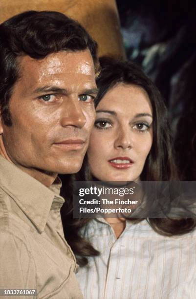 American actor Patrick Wayne and English actress Sarah Douglas in the roles of Ben McBride and Lady Charlotte Cunningham during the filming of "The...