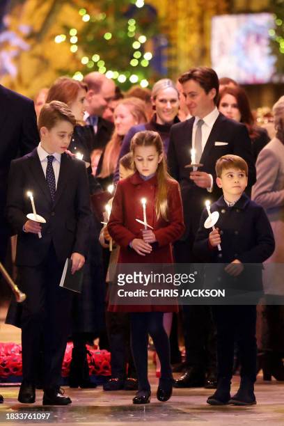 Britain's Prince George of Wales , Britain's Princess Charlotte of Wales and Britain's Prince Louis of Wales attend the "Together At Christmas" Carol...