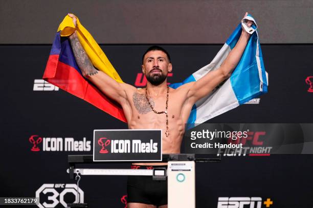 In this handout image provided by UFC, Chris Gutierrez poses on the scale during the UFC Fight Night weigh-in at UFC APEX on December 08, 2023 in Las...
