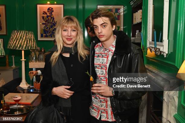 Lucy Brown and Sascha Bailey attend Alistair Guy's birthday cocktail party at Hackett London, Savile Row, on December 8, 2023 in London, England.