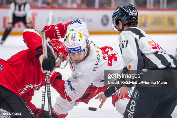 Jason Fuchs of Lausanne HC face-off against Victor Rask of SC Rapperswil-Jona Lakers during the Swiss National League match between Lausanne HC and...