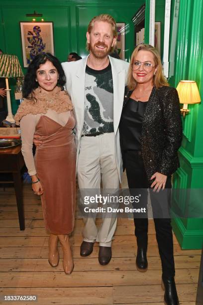 Maria Jose Bavio, Alistair Guy and Erica Bergsmeds attend Alistair Guy's birthday cocktail party at Hackett London, Savile Row, on December 8, 2023...