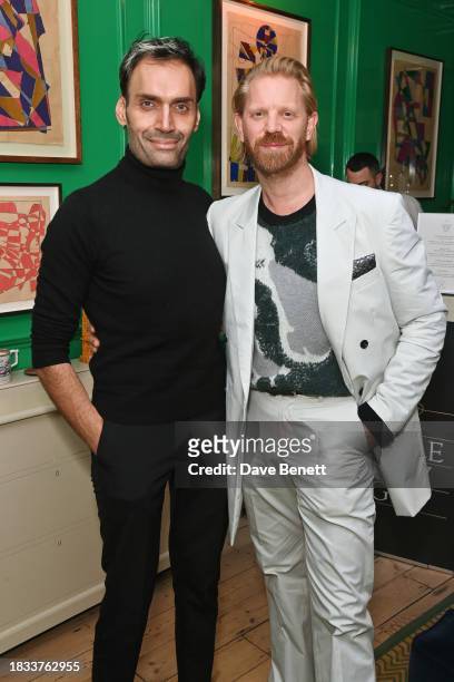 Jeetendr Sehdev and Alistair Guy attend Alistair Guy's birthday cocktail party at Hackett London, Savile Row, on December 8, 2023 in London, England.