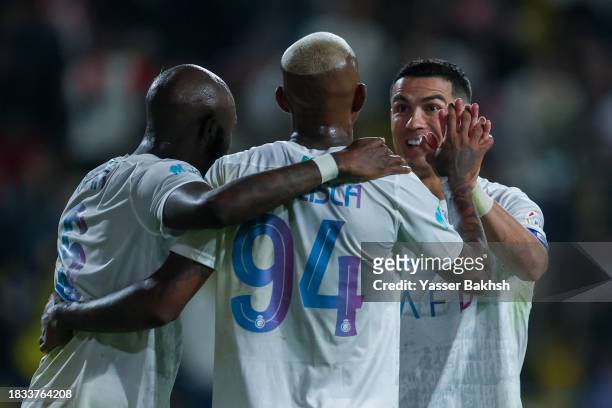 Anderson Talisca of Al Nassr celebrating with teammate Cristiano Ronaldo after scoring 4th goal during the Saudi Pro League match between Al-Nassr...