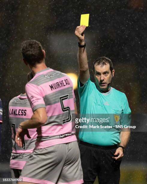 Partick Thistle's Aaron Muirhead is shown a yellow card by referee Alan Muir during a cinch Championship match between Raith Rovers and Partick...