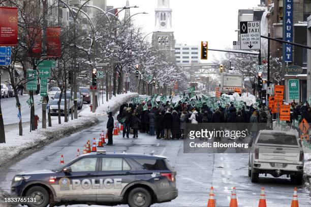 Public sector workers and supporters during a strike outside the Centre hospitalier de l'Universite de Montreal hospital in Montreal, Quebec, Canada,...