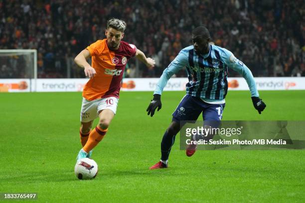 Dries Mertens of Galatasaray and Badou Ndiaye of Adana Demirspor battle for the ball during the Turkish Super League match between Galatasaray and...