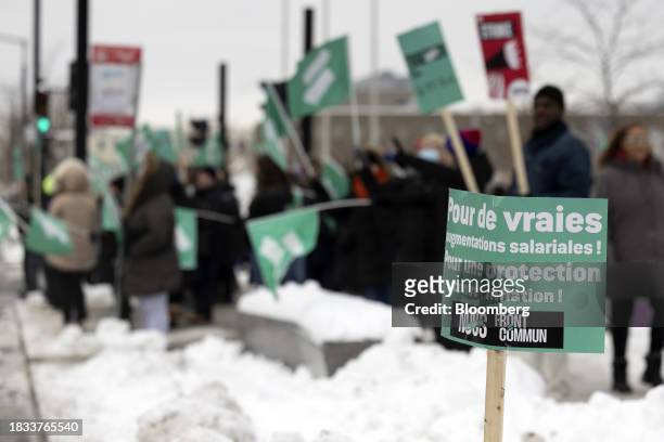 Front Commun sign during a strike outside McGill University Health Centre in Montreal, Quebec, Canada, on Friday, Dec. 8, 2023. As many as 600,000...