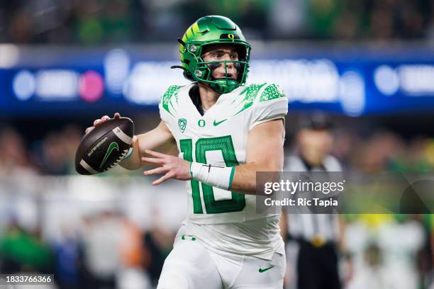 Bo Nix of the Oregon Ducks throws on the run against the Washington Huskies during the Pac-12 Championship at Allegiant Stadium on December 1, 2023...