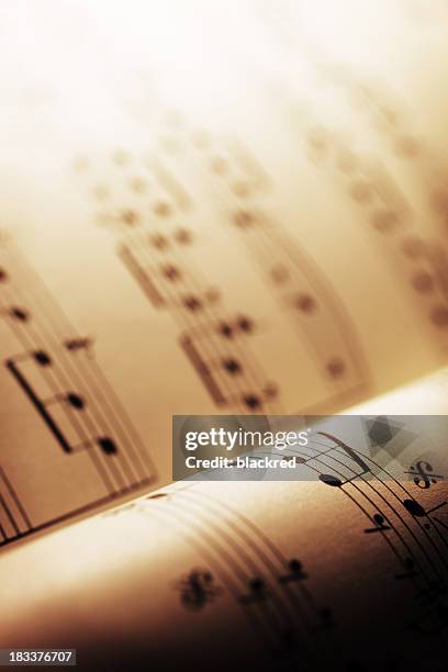 sheet music - classical music background stock pictures, royalty-free photos & images