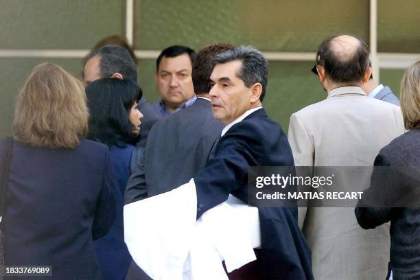 Group of medical experts of Chilean Legal Medical Institution enters the Military Hospital in Santiago, Chile, 10 January 2001. Chilean Judge Juan...