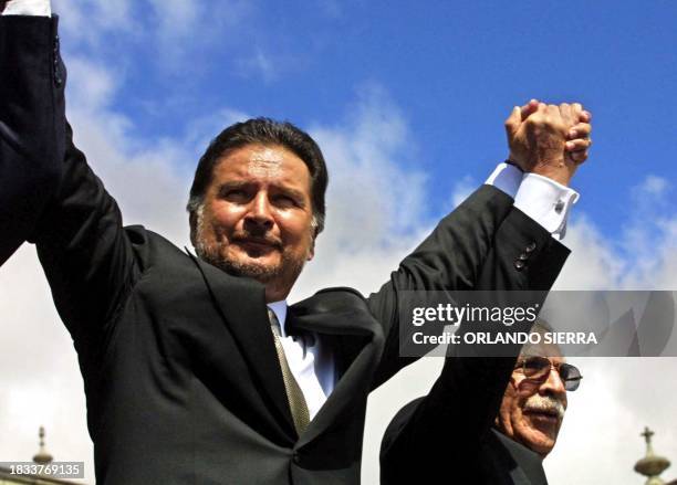 Guatemalan President, Alfonso Portillo , along with former Guatemalan dictator Efrain Rios Montt, greet the crowds 14 January 2003, in the Plaza de...