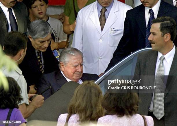 Former Chilean dictator Gen. Augusto Pinochet leaves the Military Hospital in Santiago 12 January, 2001. Pinochet underwent a third day of medical...