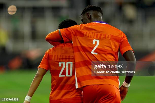 Pape Mar Boye of the Clemson Tigers congratulates Shawn Smart after his goal against the West Virginia Mountaineers during the Division I Men's...
