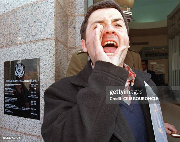 Marcelo Cabrera, leader of a support group for Chile's former dictator Gen. Augusto Pinochet, shouts slogans outside the US Embassy in downtown...