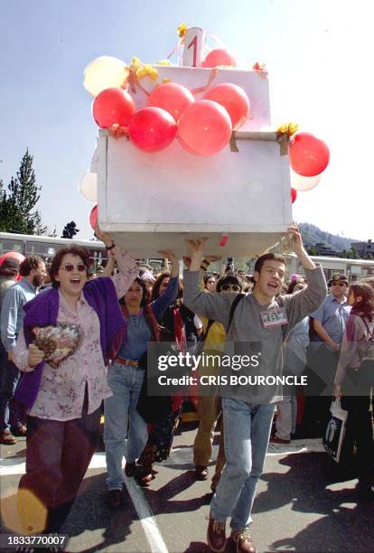 Group of partcipants march in Santiago to celebrate the first anniversary of the detention of Gen. Augusto Pinochet in England, 16 October 1999. Un...